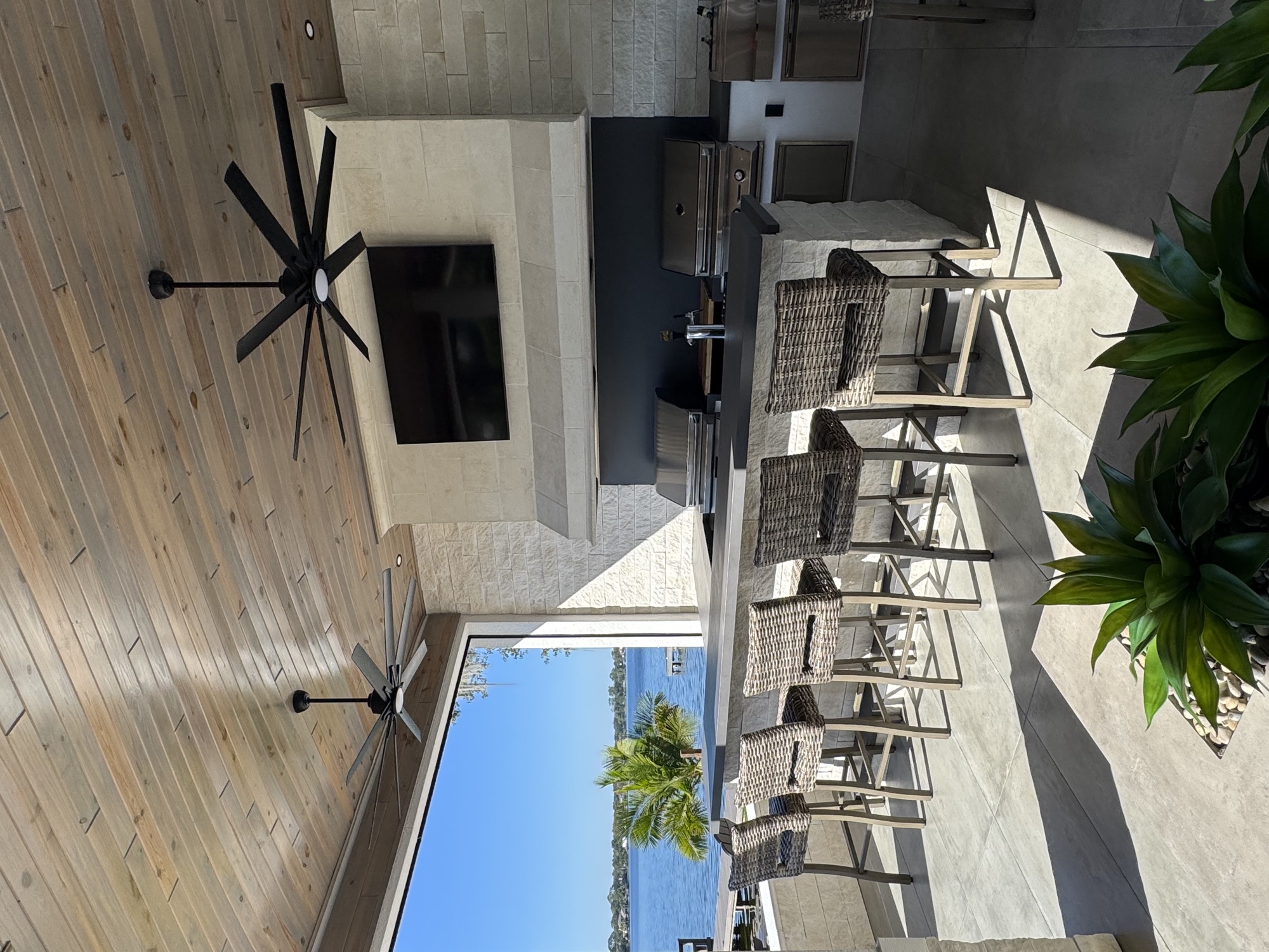 Waterfront outdoor kitchen with ventilation hood in Apopka, FL