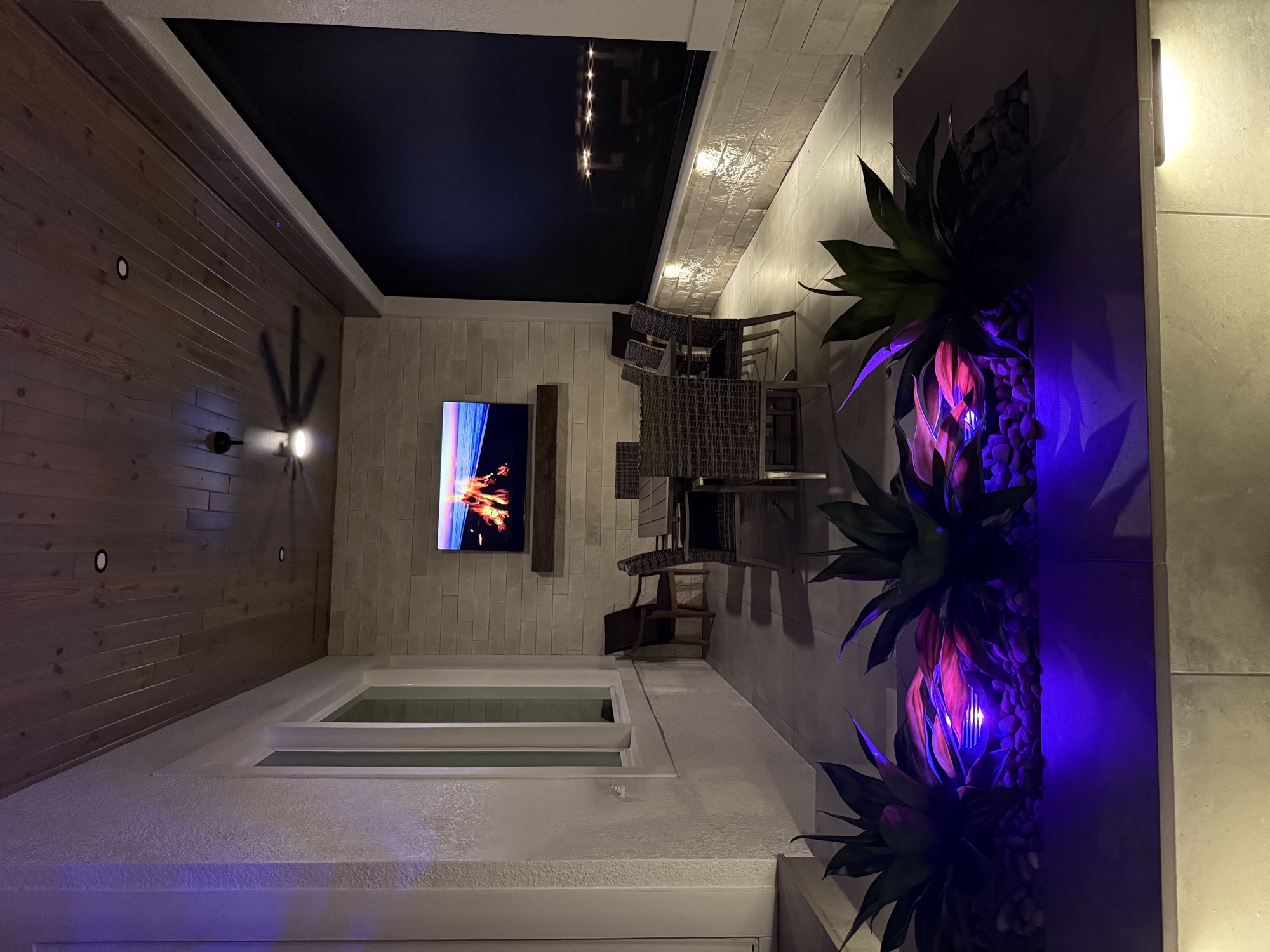 The lanai and water feature with accent lighting in Apopka, FL