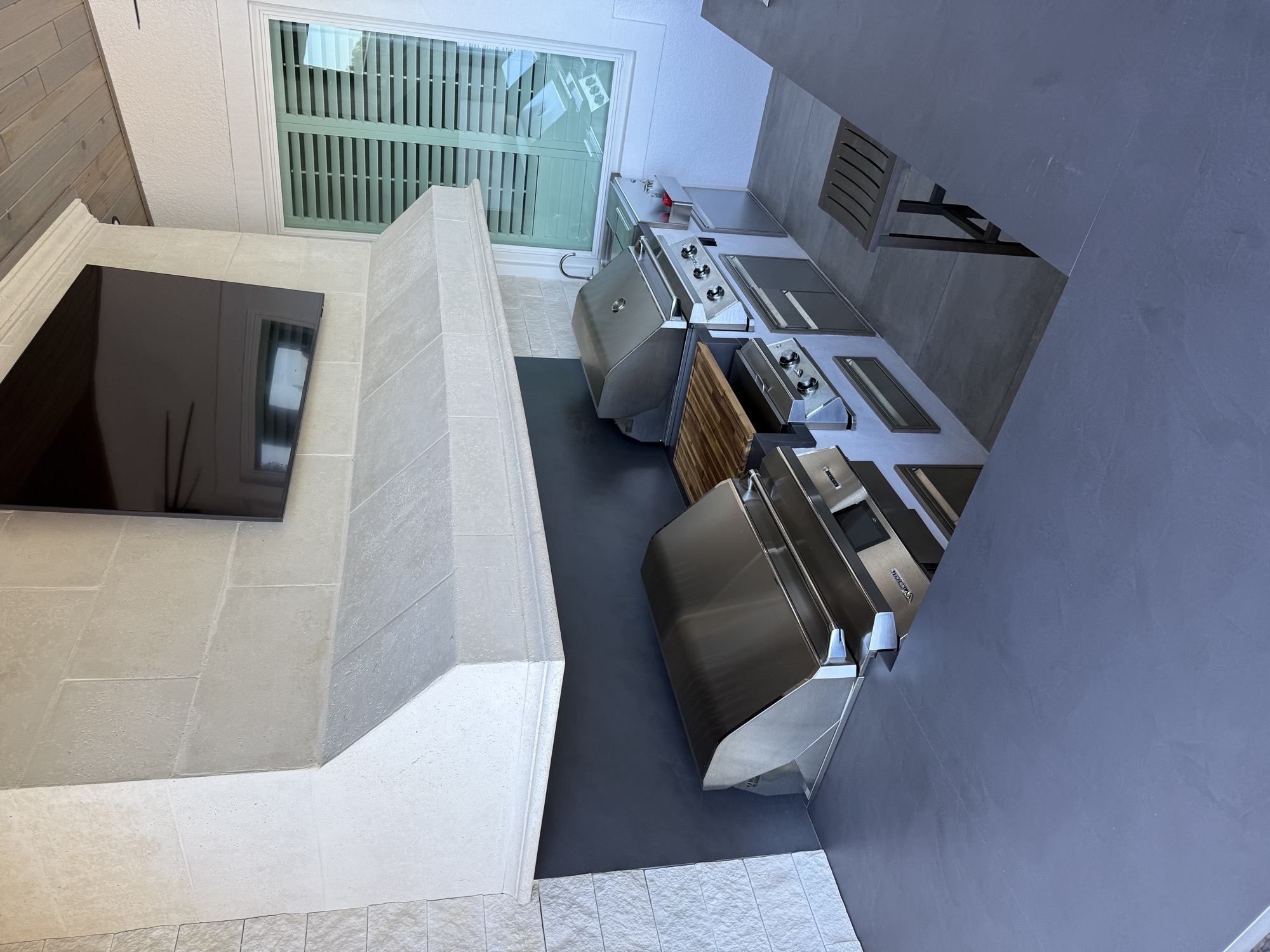 The Twin Eagles grills and stainless storage drawers during installation in Apopka, FL