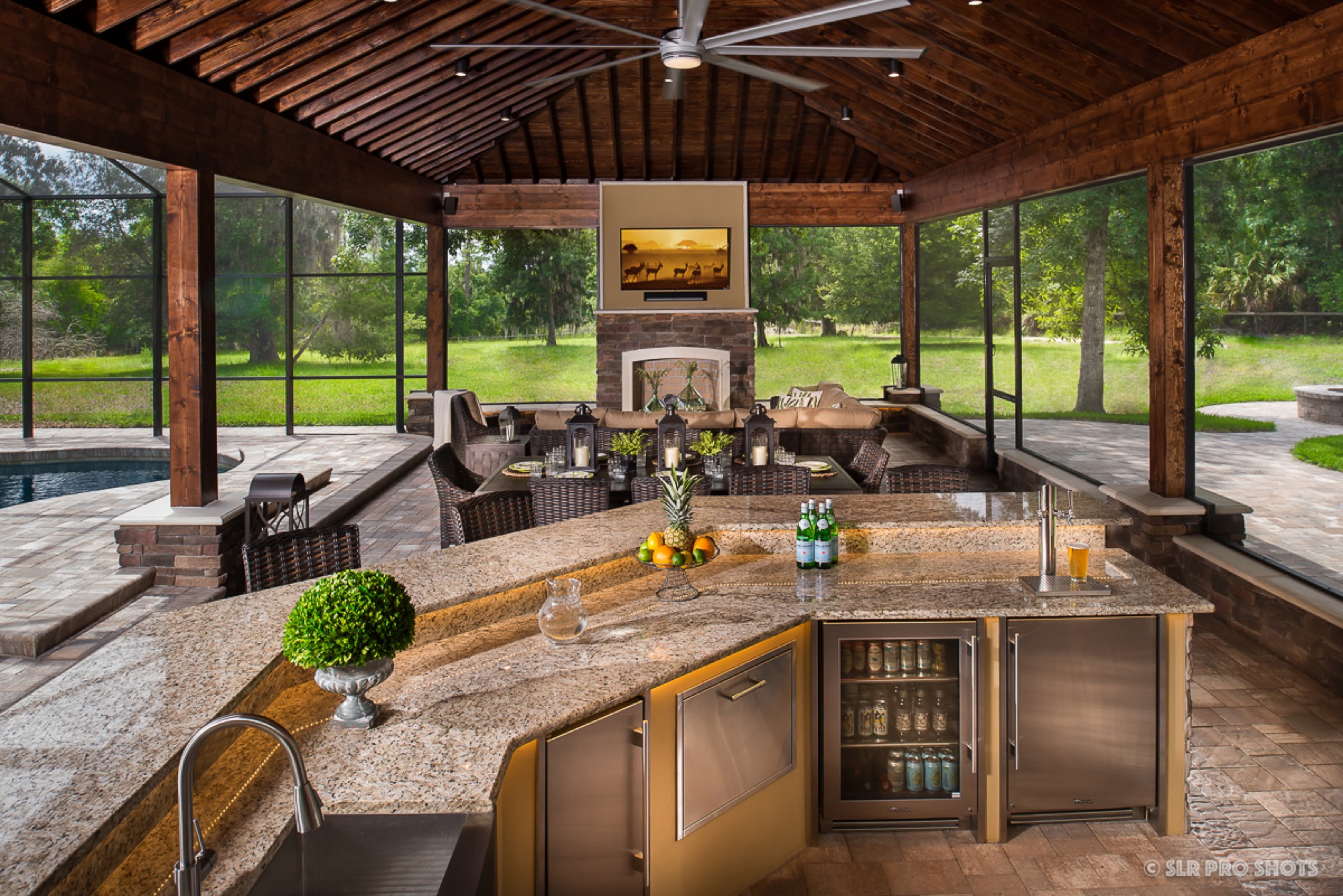 The finished outdoor kitchen and bar with stone veneer in Geneva, FL